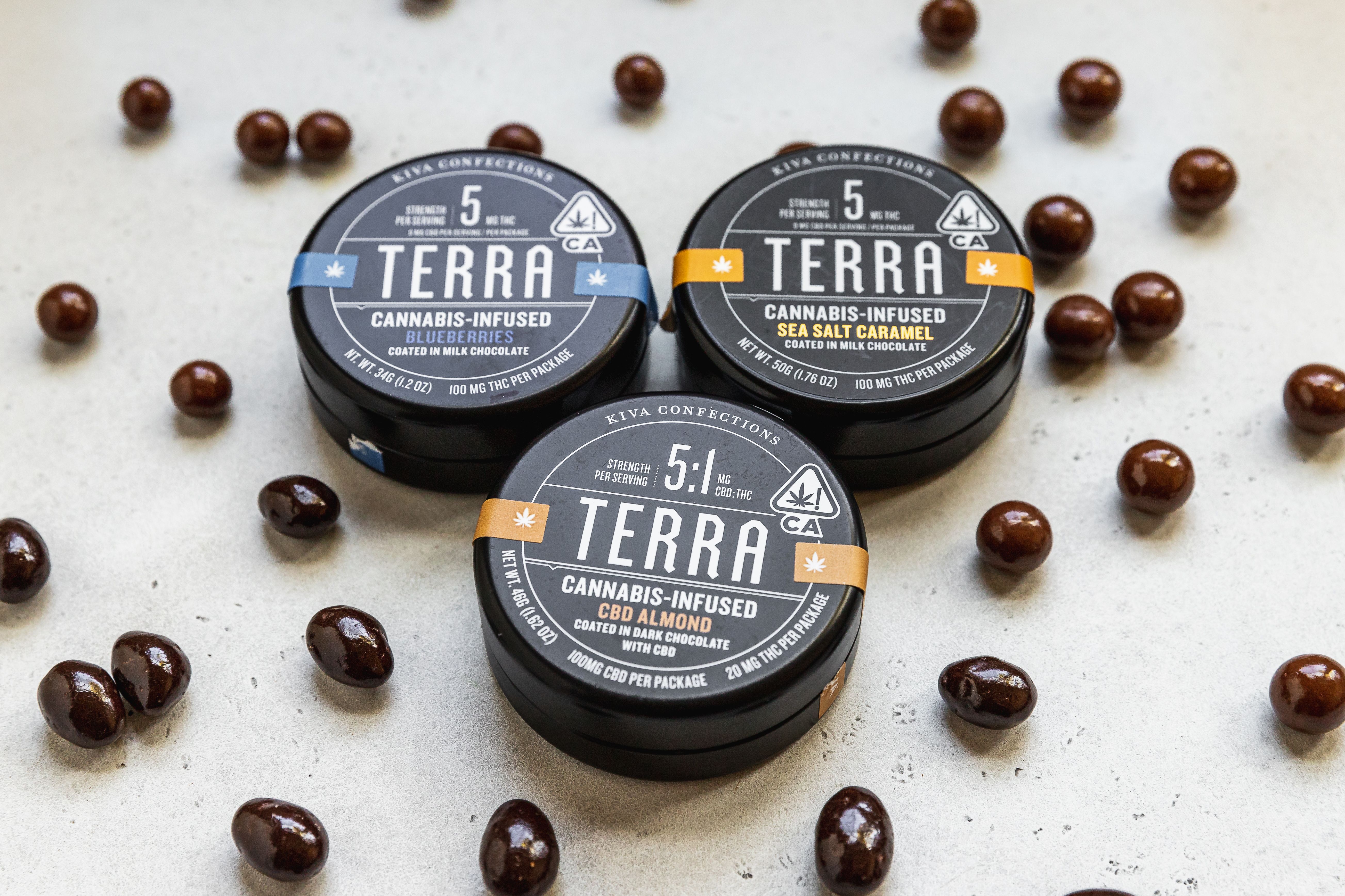 Cannabis-infused chocolate edibles in custom tin containers, showing branded custom packaging