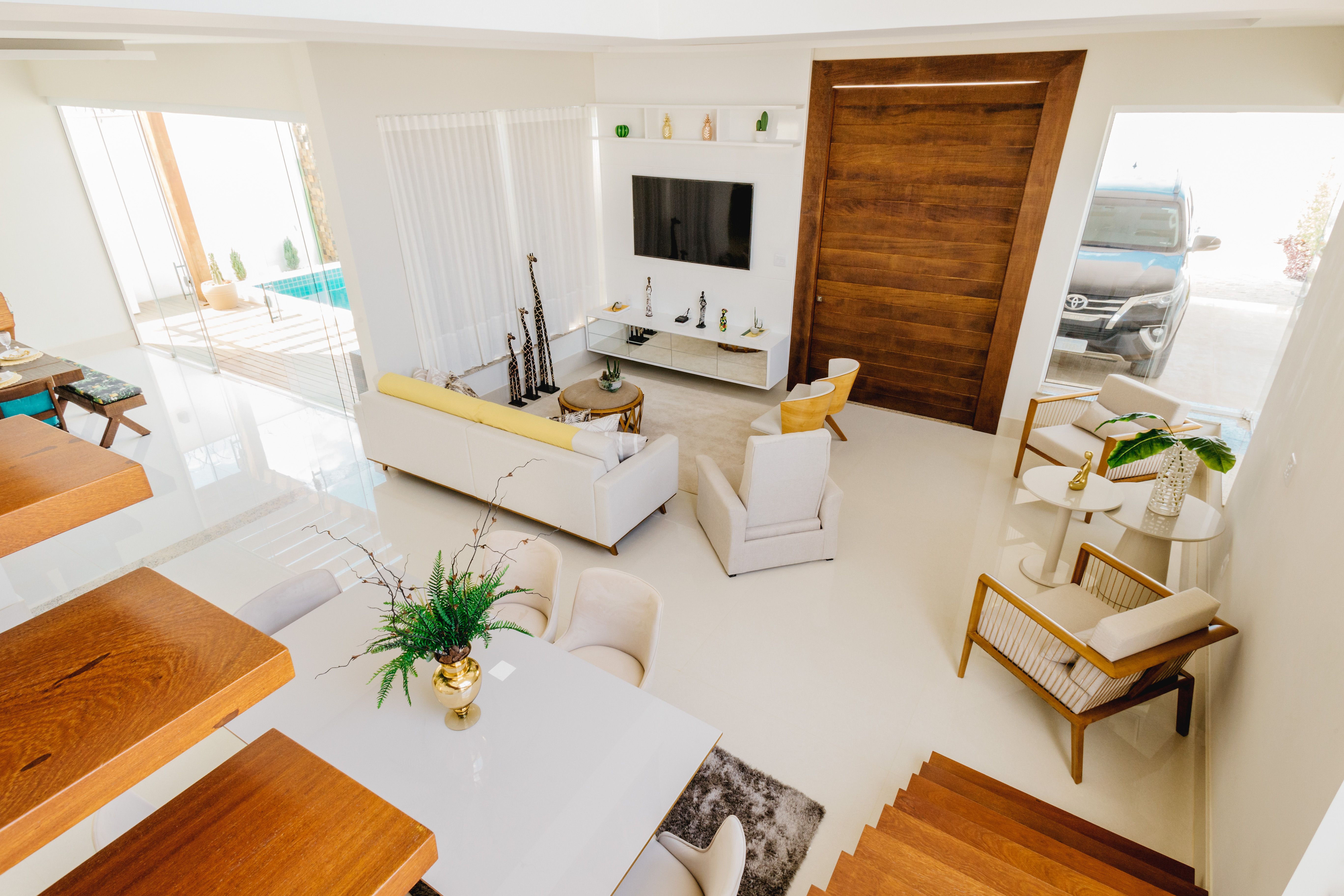 Spacious modern minimalist living room with elegant furniture and soft natural light