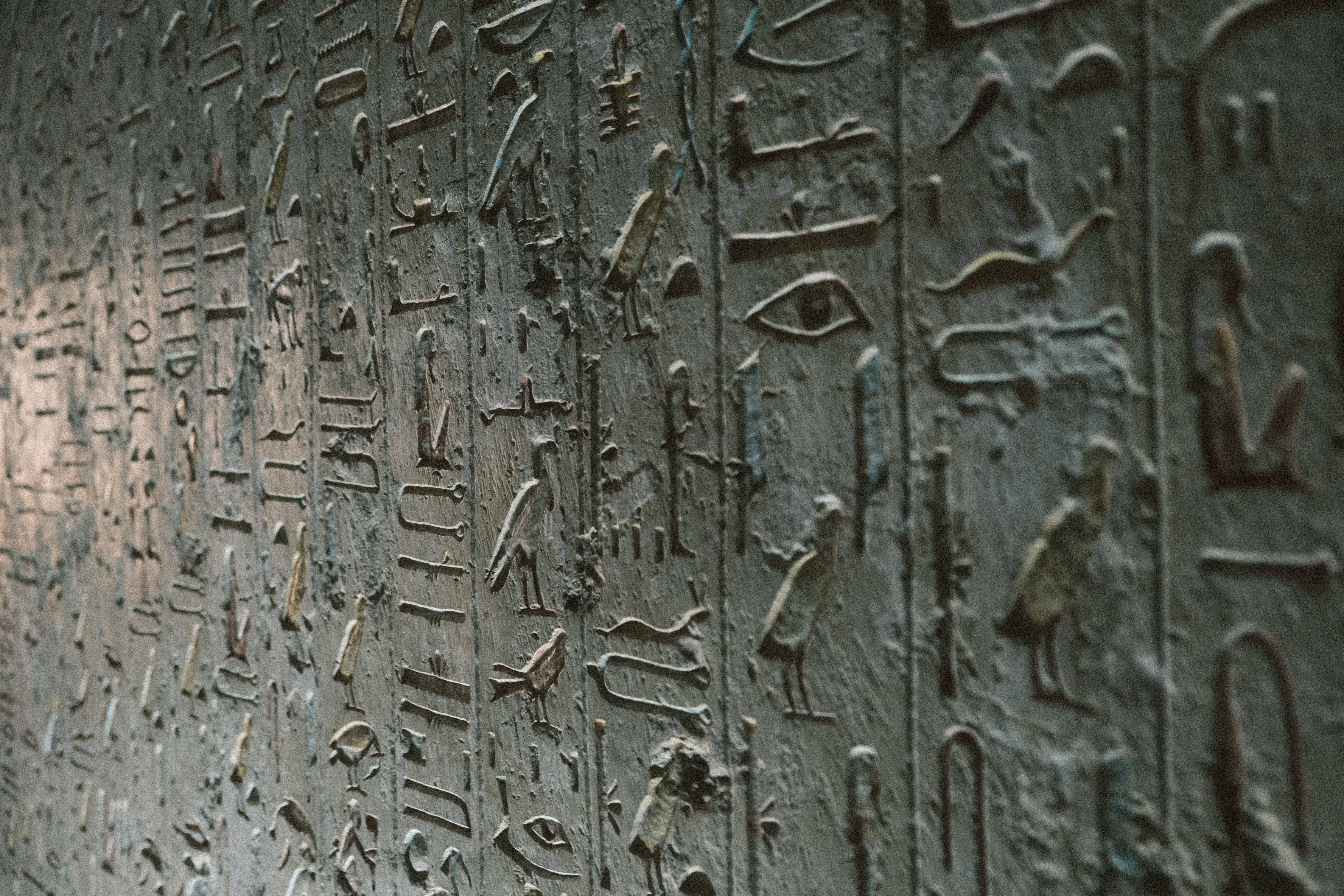 Close-up of ancient Egyptian hieroglyphics on a stone wall in Luxor